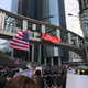 The “Chinazi” flag flying over a large crowd of protesters.
